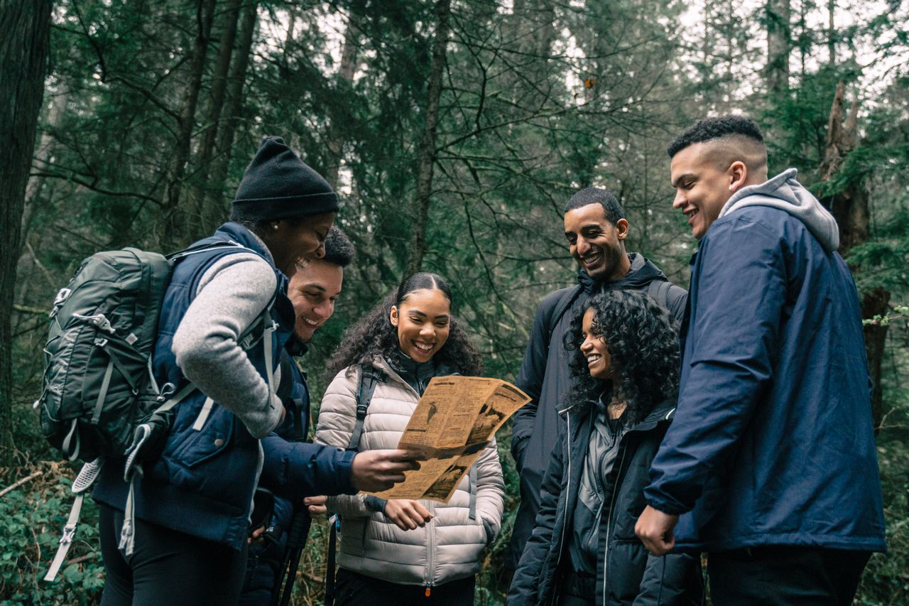 Group of people embracing outdoor recreation and slingshot shooting